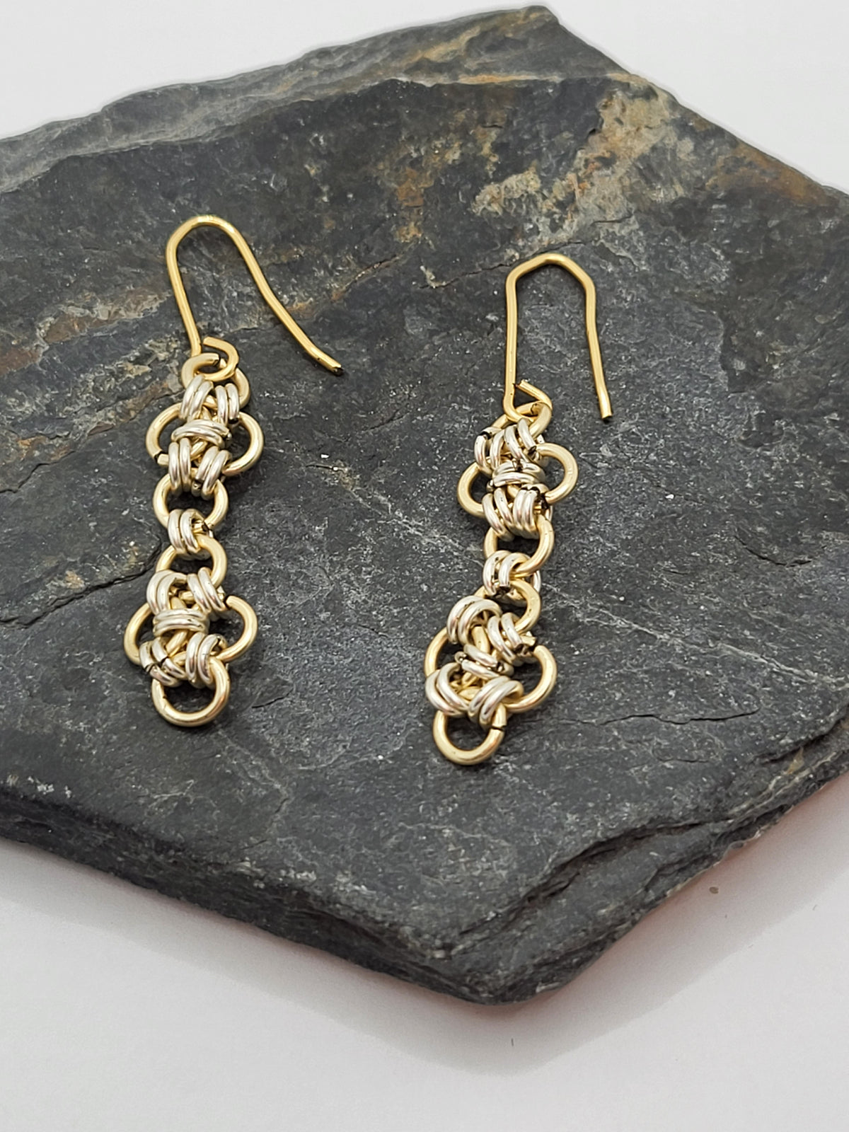 gold and silver chain mail design earrings