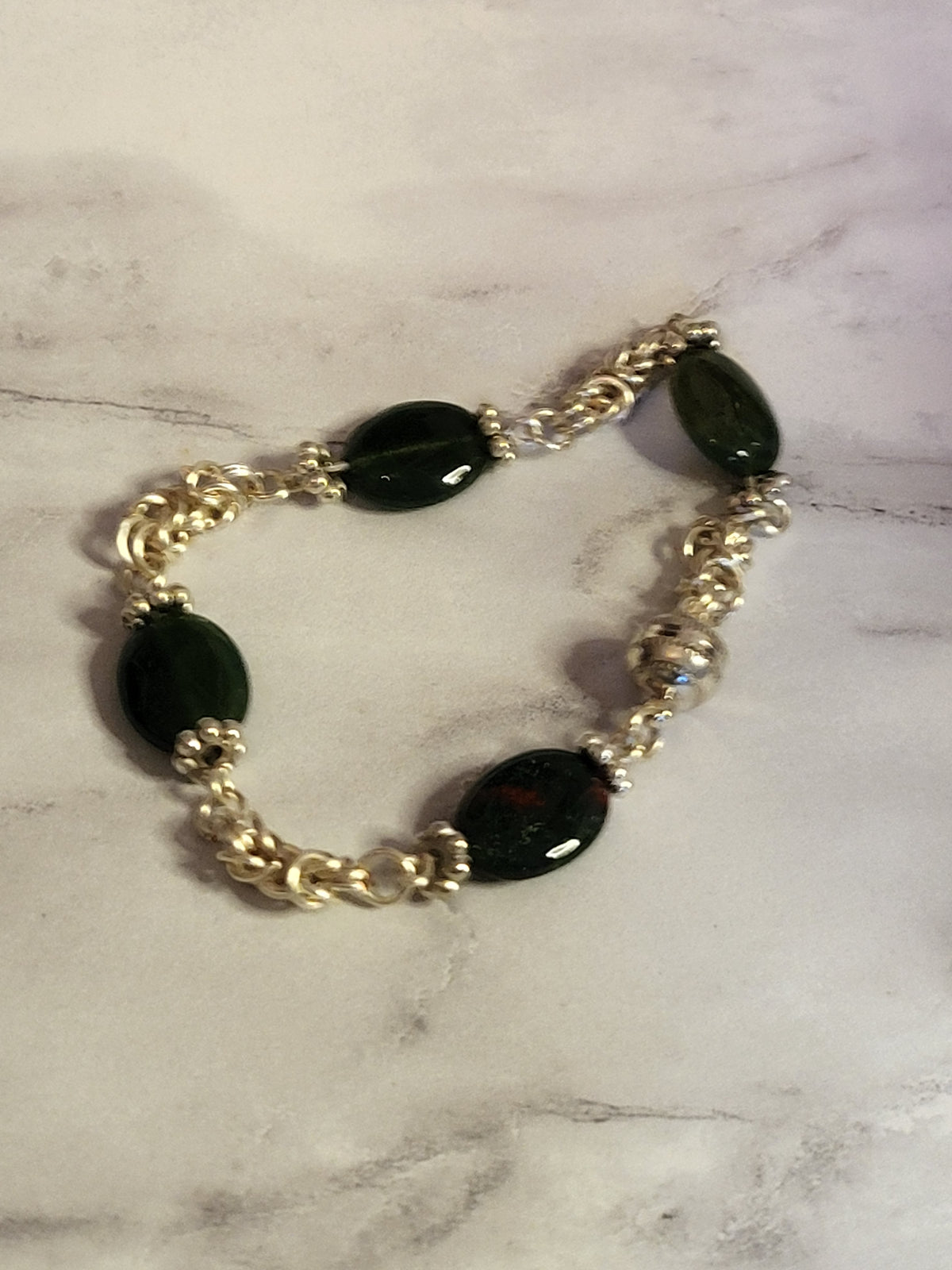Silver chain mail braclet with green beads and magnetic clasp
