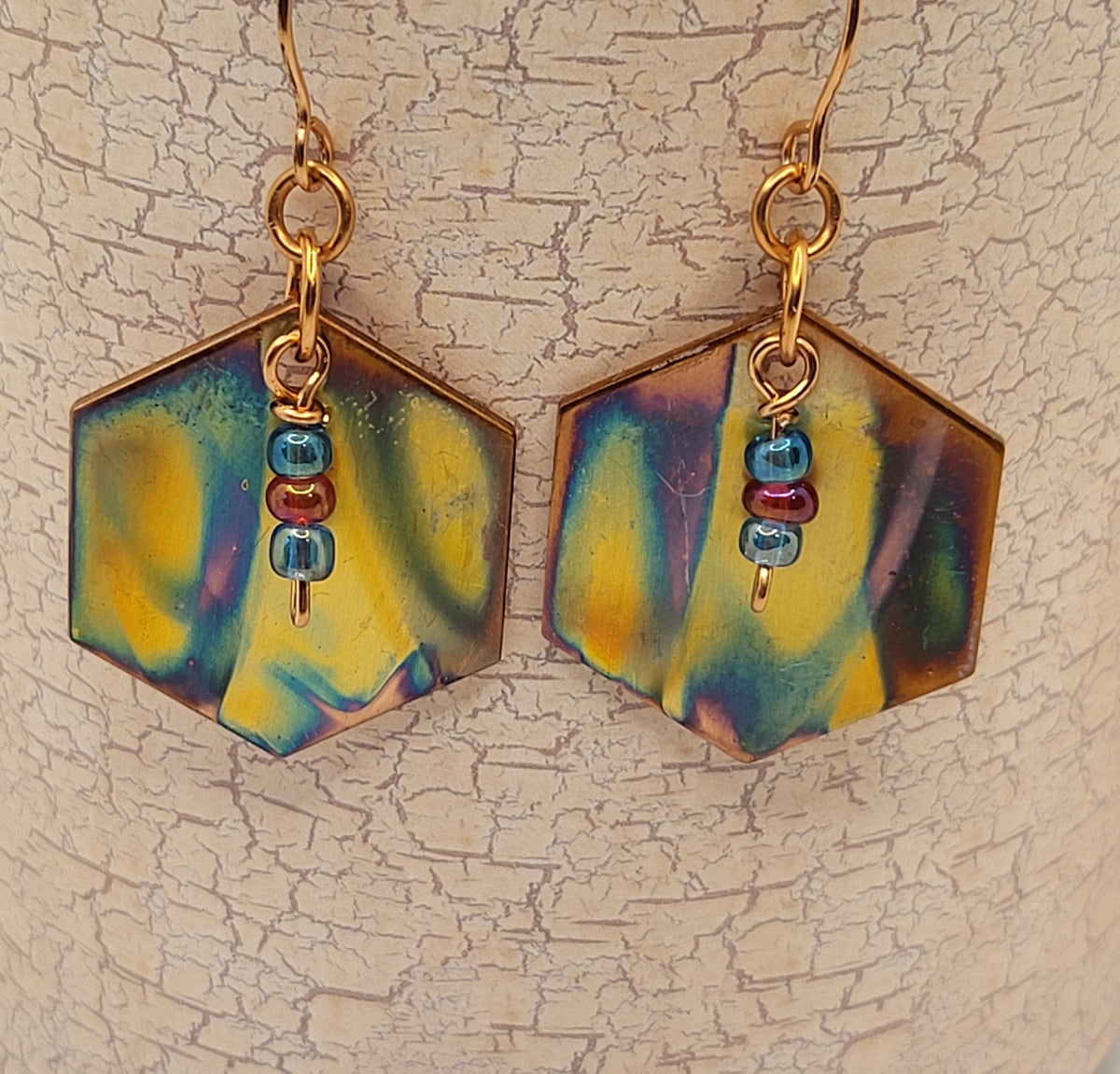 Flame colored hexagon shaped earrings